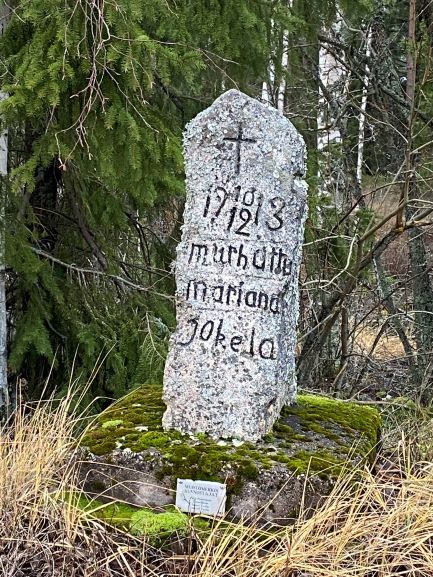 Tombstone along the road