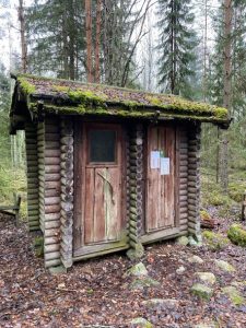 Outhouse toilet and firewood storage